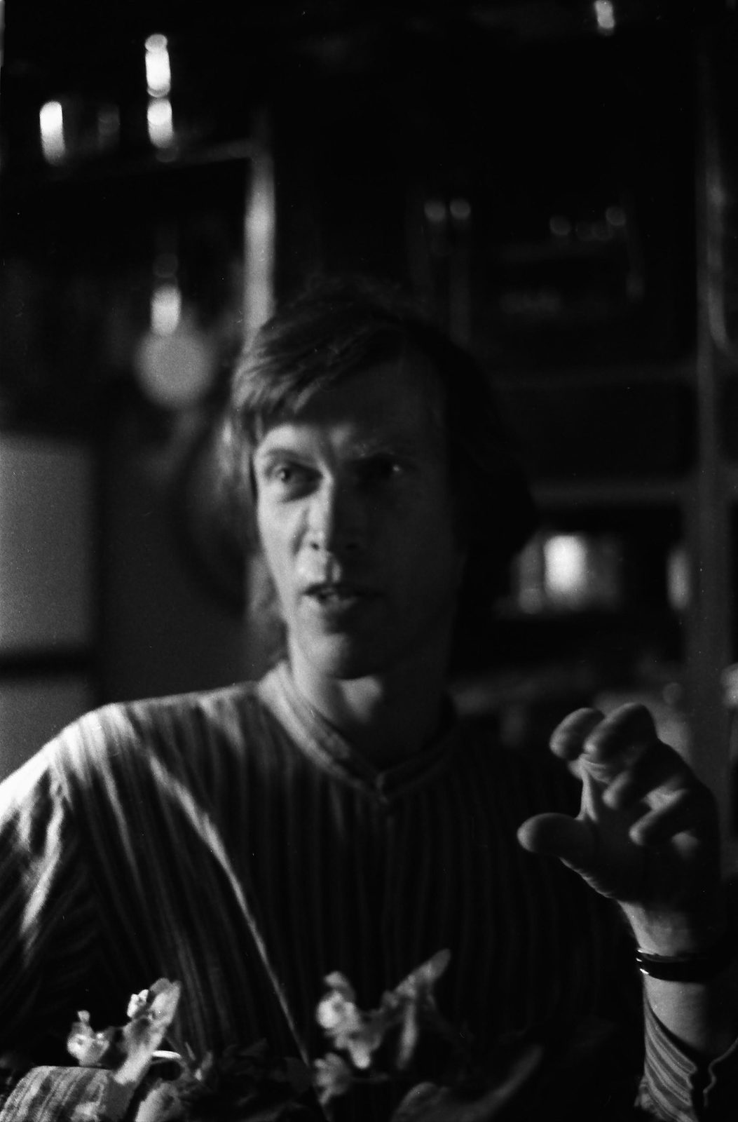 Dick Arnall in a striped shirt, mid-conversation with a hand raised