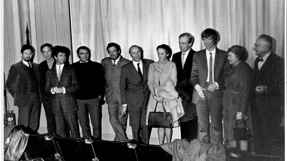 Festival guests standing in a row in front of curtains, Cambridge Animation Festival, 1967